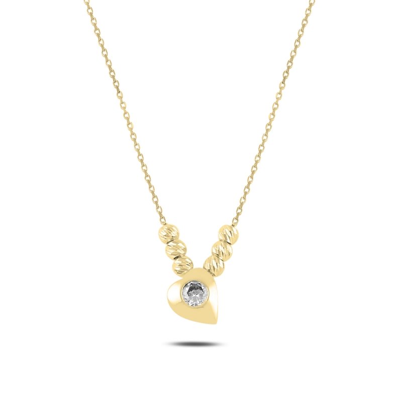 arte Halskette mit Herz-Anhänger, kleinen Kugeln und funkelndem Stein, minimalistisch.
